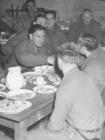 Baseball icons (far side of table, left to right): Frankie Frisch, manager of the Pittsburgh Pirates; Mel Ott, player-manager of the New York Giants