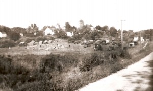 5th Division tents and trucks cover a field outside Albion.  Note the courthouse in the background.