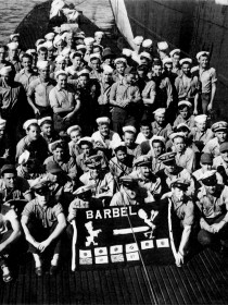 Crew of the USS Barbel sport 10-kill battle flag following third war patrol - October 1944