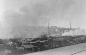 As members of the 90th Infantry Division pour into Hof, Germany, retreating enemy soldiers set the rail yards ablaze - April 1945. (U.S. Army Signal Corps Photo, Courtesy National Archives)