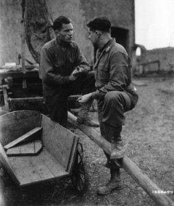 Captain Herbert Ochmiche of the 358th Infantry, 90th Infantry Division, talks with freed POW, Miegbysav Mrozak, at Metz, France - September 1944. (U.S. Army Signal Corps Photo, Courtesy National Archives)