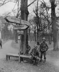 Soldiers of the 90th Infantry Division, Sgt. Robert Gore (left) of Europa, Missouri and Pvt. Harry Curry (right) of Leewood, West Virginia, test communications in Wilhelmsbad, Germany. (U.S. Army Signal Corps Photo, Courtesy National Archives)